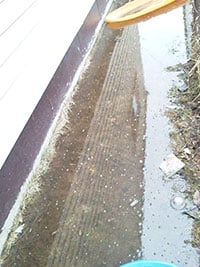 Example of house with improper grading and drainage